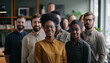 © Cheetose - Group of diverse people standing in an office looking happy