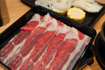 Wall Mural - Fresh thin sliced beef to make hotpot. Japanese style food.