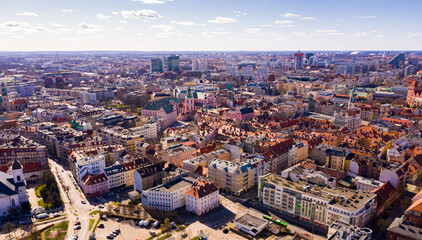 Wall Mural - Aerial view of Poznan modern cityscape overlooking new residential areas and historical center on sunny spring day, Poland