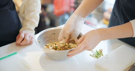 Wall Mural - Chef hands, cooking and food in restaurant with bowl, vegetables and prepare ingredients for nutrition. People, working and catering service for diet at cafeteria with meal, dinner or lunch on table