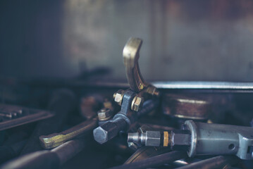 Mechanic tools engineering equipment car auto repair shop with copy space. Blurred background mechanical service. Heavy screw grungy rusted wrenches dirty screwdriver object. Industrial hardware set