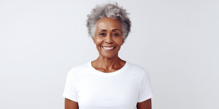 A woman with grey hair wearing a white shirt. Suitable for various uses