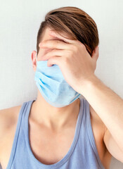 Wall Mural - Sad Young Man in Flu Mask