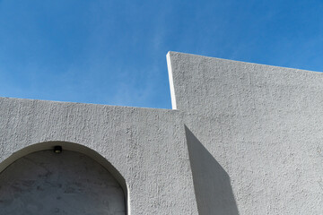 Wall Mural - white cement architecture background with blue sky