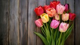 Fototapeta Tulipany - Spring background!A bouquet of tulips on a wooden background.Holiday greeting card for Valentine's Day, Woman's Day, Mother's Day, Easter!
