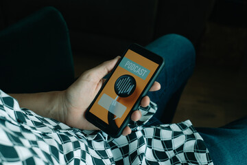 man listening a mock podcast in his smartphone