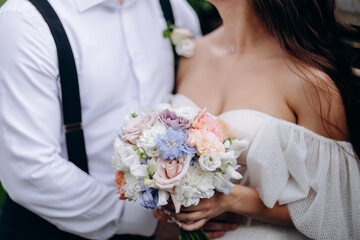 Wall Mural - Wedding flowers. Bridal bouquet with exotic flowers. Bride holding a bouquet. wedding details. soft focus