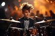 A young stylish boy plays the drums