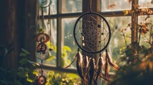 Traditional Dreamcatcher Hanging In A Window With Morning Sunlight
