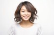 © Surachetsh - pretty Asian girl showcases flawless skin and flowing long hair in a striking photo, set against a pristine white background for a timeless and clean look. Generative AI.