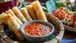 Thai Spring Rolls with sweet chili sauce, street food festival in Thailand