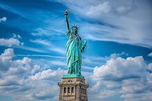 The Statue Of Liberty In New York On The Background Of The Blue Sky, USA. The Statue Of Liberty Is One Of The Symbols Of New York.