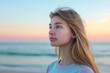 © Tymofii - Portrait on the beach young woman with long blond hair