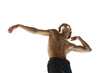 Dynamic portrait of shirtless male dancer posing with arms extended head tilted back against white studio background. Concept of human motions, wellness, natural beauty of male body.