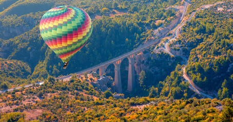 Wall Mural - Hot air balloon flying over Varda Railway bridge