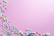 Easter holiday purplish pink background, framed on left with colorful eggs.