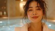 © Jerome Mettling - Asian woman at a thalassotherapy pool. Femme asiatique à la piscine d'une thalassothérapie.