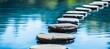 Zen concept tranquil blue water with stepping stones for relaxation and meditation