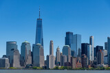 Fototapeta Miasta - Panoramic view of skyscrapers on the waterfront of lower Manhattan, New York City, NY, USA seen from the Hudson river side against a clear blue sky