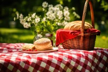 Picnic Basket On The Tablecloth In Summer Garden, Summer Picnic Background. Cute Wicker Basket With Foods, Fruits. The Tablecloth On The Grass, Ai Generated