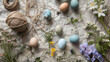 A botanical Easter flat lay with pressed wildflowers dyed eggs in natural tones and twine on a textured paper background.
