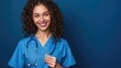 Friendly nurse in scrubs with a warm smile offering comfort and support to patients.