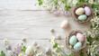 A flat lay of Easter-themed items including pastel-colored eggs a small basket and fresh spring flowers on a light wooden background.