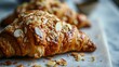 Close up shot of a Almond Croissant against white background