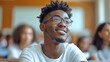 © Ellionn - African American student sit at class and learning. School, university or college education concept. Young black teenager portrait. Person study at campus. Smiling confident guy prepare for exam.