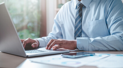 Canvas Print - business, chart, pie, graph, investment, finance, diagram, pie chart, financial, growth. businessman putting casual suit typing keyboard with pie chart document showing company financial information.