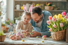 Dad And Child In Bunny Ear Headbands Decorating Eggs For Easter 