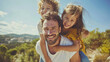 © MP Studio - happy outdoor moment with a man giving two children piggyback rides