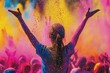 © Konstiantyn Zapylaie - Person celebrating at a vibrant color festival, arms raised in joy.