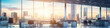 © Dreamer - anorama of a large office with large panoramic windows and a view of the metropolis at dawn in the rays of the sun. AI generated