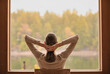 © kieferpix - happy woman rest relax on chair in comfort house living room dreaming looking out window