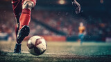 Fototapeta Sport - Close - up photo of a football player's foot kicking the ball
