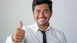 Latino adult man gives a thumbs up, sales concept, sales consultant, automotive, real estate, working, tie, dress shirt