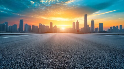 Wall Mural - Empty asphalt road and modern city skyline with building scenery at sunset. high angle view.