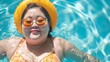Overweight young Asian woman wearing swimsuit relaxing in the pool Happy plus size woman cheery funny Vacation Traveling in summer