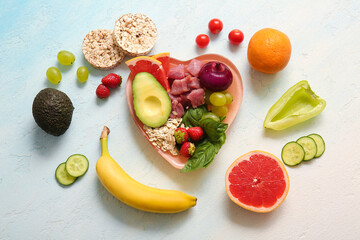 Wall Mural - Plate with fresh healthy products on light background. Diet concept