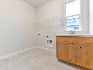 Modern residential empty laundry room interior