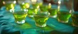 Unconventional alcoholic beverages for adult parties, resembling lime jelly shots and served on a tablecloth.