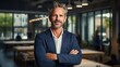 © Alex - Portrait of confident mature businessman with arms crossed standing in office. Generative AI