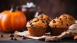 Chocolate muffins with chocolate chips and pumpkins on wooden background Generative AI