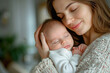 © Kien - portrait of happy mum holding sleeping infant child on hands