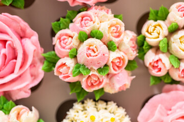 Wall Mural - Delicious Gourmet Cupcakes Topped with Buttercream Frosting Flowers