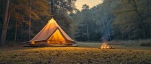An Exposed Bell Tent At Night With Pleasant Light And Surrounded By Trees And A Little Campfire