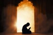 Moslem man silhouette doing salat praying for Allah inside the mosque at night, tahajjud. Orange smoke around the mosque