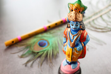 Wall Mural - Sri Krishna statue with peacock feather. Lord Krishna Standing with Flute Vishu festival Kerala