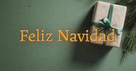 Poster - Feliz navidad text in orange over christmas gift on green background